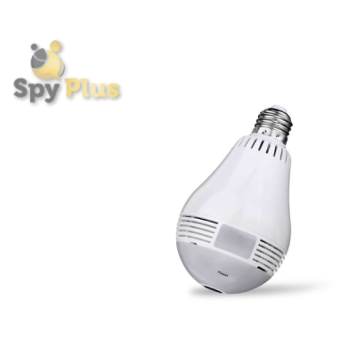 This photo shows a white lamp with a built-in camera. The camera is located on the front of the lamp, just below the light bulb. The lamp has a modern, clean design with a white finish. The camera lens is small and circular, and blends in with the lamp's overall aesthetic.