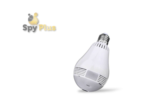 This photo shows a white lamp with a built-in camera. The camera is located on the front of the lamp, just below the light bulb. The lamp has a modern, clean design with a white finish. The camera lens is small and circular, and blends in with the lamp's overall aesthetic.